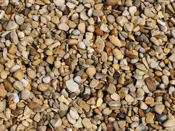 Pea gravel small rounded decorative stone mixed tan gray landscaping gravel