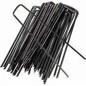 Metal weed barrier pins used to secure landscape fabric and edging